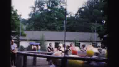 Catskill New York (1957): Kids Riding A Ride That Spins In Circles At A Theme Park