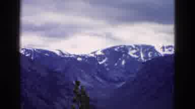 Yellowstone Wyoming USA (1958): The Mountains The Snow And The Clouds Above It Are