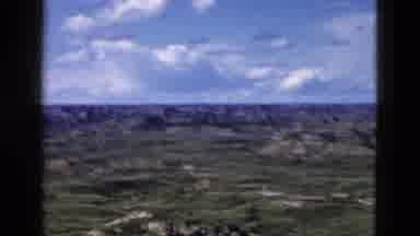 Yellowstone Wyoming USA (1958): Layered Rocky Formations In Distance With Valleys