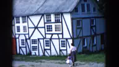 Hicksville New York (1957): Lady With A Young Girl Passing By A Very Colorful