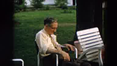 Hicksville New York (1957): Adults Sitting In White Chairs Watching A Little Girl