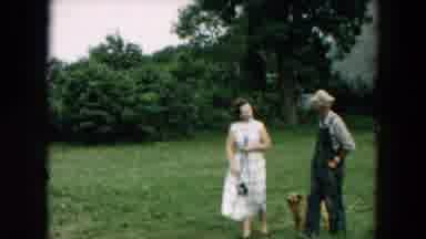 Hicksville New York (1957): Girl Wearing Yellow Dress Holds Leash Of Black And