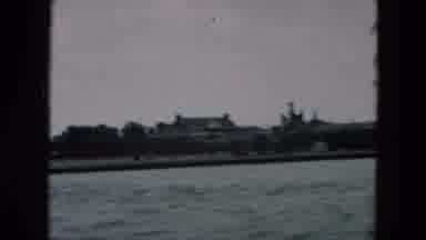 Hicksville New York (1957): Buildings Dotted The Shoreline Of A Body Of Water As