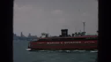 Hicksville New York (1957): Boat Water City Statue Fog Red Grey Waves Wind Steam