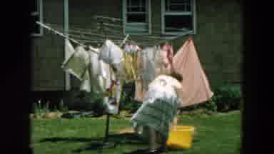 Hicksville New York (1957): A Woman Hanging Up Some Clothes In Very Strong Wind