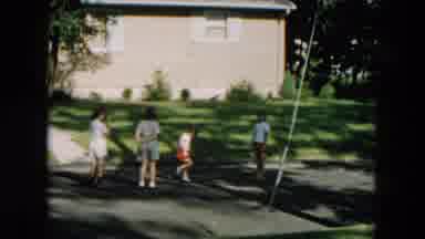 Hicksville New York (1957): Kids Playing Jump Rope In Street On A Sunny Day