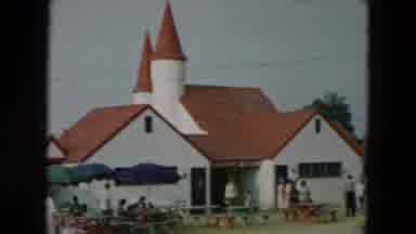 Hicksville New York (1957): A View Of A Town With Historical Architecture