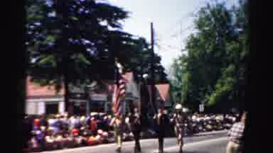 Normal Illinois USA (1957): People Are Watching A March Past On The Street