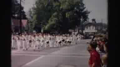 Normal Illinois USA (1957): A Marching Band And Group Of Jugglers Marching Through