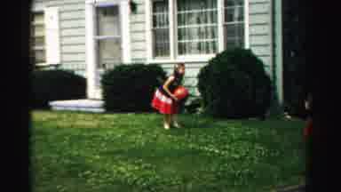 Normal Illinois USA (1957): Twin Girls Wearing Red White And Blue Dresses Toss Red