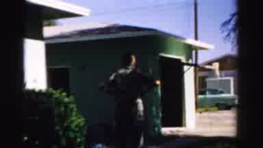 Normal Illinois USA (1957): Man Taking His Car Out Of The Garage For A Walk On A