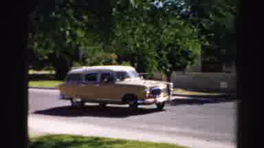 Normal Illinois USA (1957): Car Backing Out Of Driveway And Green House With Yard