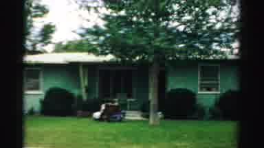 Normal Illinois USA (1957): Slow Moving View Of A Neighborhood House Next To A