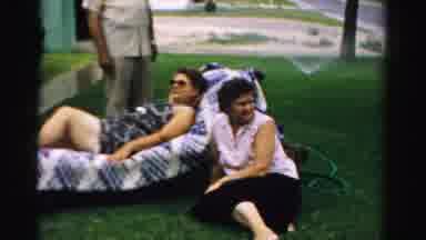 Normal Illinois USA (1957): Residents Relax On The Grass Very Well Cared For On A