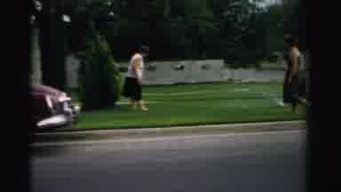 Normal Illinois USA (1957): Two Women On In Front Yard One Older Male Crossing
