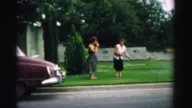 Normal Illinois USA (1957): Two Women In Yard With Garden Hose