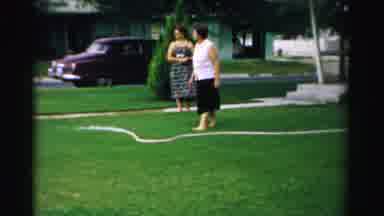 Normal Illinois USA (1957): Garden Hose Let Loose And Snaking Around The Yard