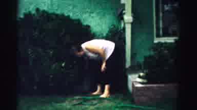 Normal Illinois USA (1957): Woman Wearing Black Pants Stands On Green Grass On A