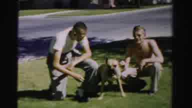 Normal Illinois USA (1957): Boy And Young Man Both Wearing Sunglasses Smiling At