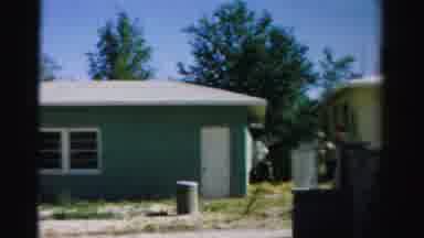 Normal Illinois USA (1957): The Exterior Of A Greenish-Blue Residential Structure