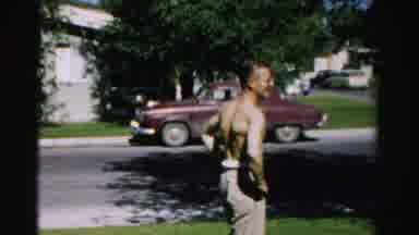 Normal Illinois USA (1957): Man Walks By External Area Of ââThe House Sunning And