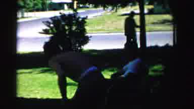 Normal Illinois USA (1957): A Woman And Two Mens Sitting In The Shadow Of A