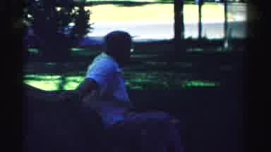 Normal Illinois USA (1957): An Older Couple Sitting Around Outside Their House