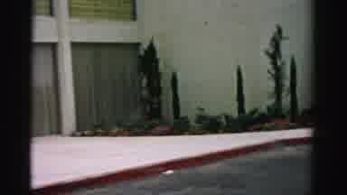 Las Vegas Nevada (1957): Panning Shot Of A Buildings Garden From On The Street