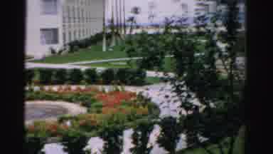 Las Vegas Nevada (1957): People Walking Toward White Garden Trellis Structure On A