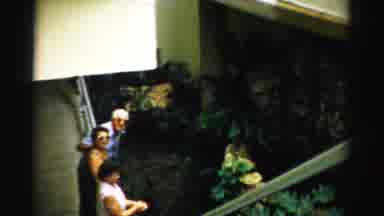 Las Vegas Nevada (1957): Three People Looking Over An Exhibit In Some Sort Of