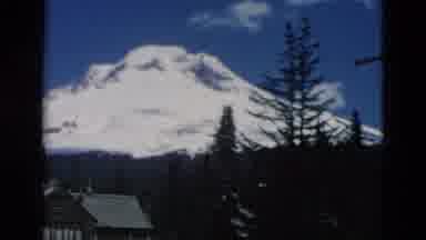 OREGON USA-: A Snowy Mountain With A Cabin Some Trees And A Powerline