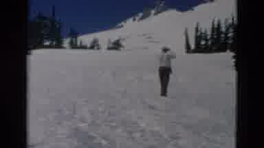 OREGON USA-: Man Wearing Black Pants Stands On Snow Drift Looking At Snow