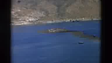 Montana USA (1958): View Of Large Lake With Brown And Rocky Hills On The Other