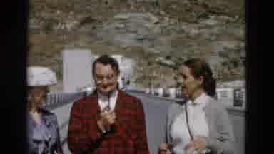 Montana USA (1958): Woman Wearing Grey Jacket Stands With Men At Hoover Dam
