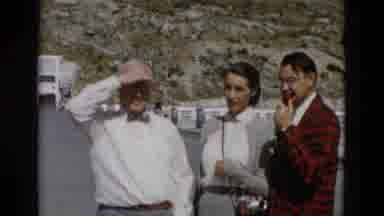 Montana USA-1958: Elder Man Young Man And Woman Stand And Talk To The Camera