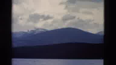 Yellowstone Wyoming USA (1958): View Of Mountains And Calm Water On A Cloudy Day