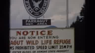 Yellowstone Wyoming USA-1958: Farragut Wild Life Refuge Entrance Sign With Speed Limit and Firearms Prohibited Notice