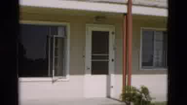 Yellowstone Wyoming USA (1958): A House With A White Front Door Windows And A