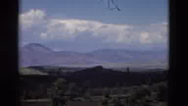 Yellowstone Wyoming USA (1958): The Mountains And The Trees And Clouds Around It