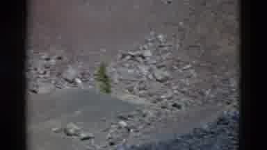 Yellowstone Wyoming USA (1958): Tourist Takes A Video Of Rocky And Barren Mountain