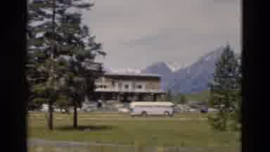 Yellowstone Wyoming USA (1958): The Houses And The Mountains Are In The Backside