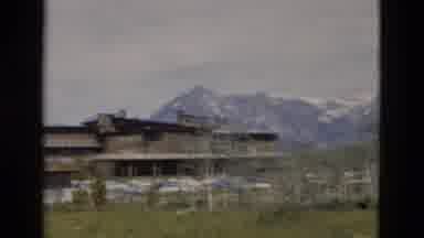 Yellowstone Wyoming USA (1958): Houses That Sit Near Forest In Front Of Huge