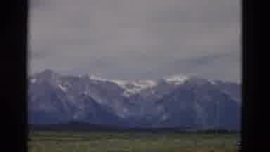 Yellowstone Wyoming USA (1958): View Of Snow Capped Mountains In The Distance As