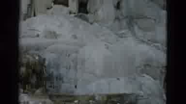 Yellowstone Wyoming USA (1958): Camera Pans Up And Captures View Of Ice Over The