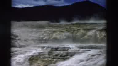 Yellowstone Wyoming USA (1958): Panning Steaming Water Landscape With Hills In