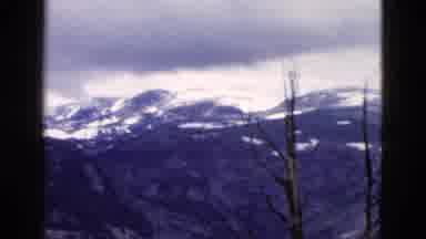 Yellowstone Wyoming USA (1958): A Snow Capped Mountain Range Appearing In The