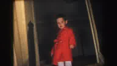 Lynbrook New York-1971: Child in Red Coat Smiling in Doorway