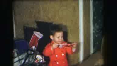 Lynbrook New York (1971): Young Boy And Girl Opens Christmas Presents Together