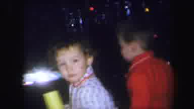 Lynbrook New York (1971): Two Boys Happily Looking Through Presents By The