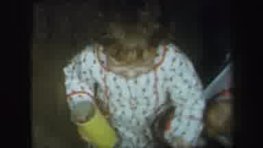 Lynbrook New York (1971): Girl Wearing White Pajamas Pulls A Blue Baby Doll